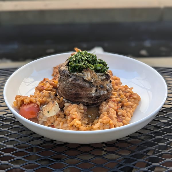 Doolittle's American cuisine: a large mushroom cap filled with greens, served over creamy risotto.